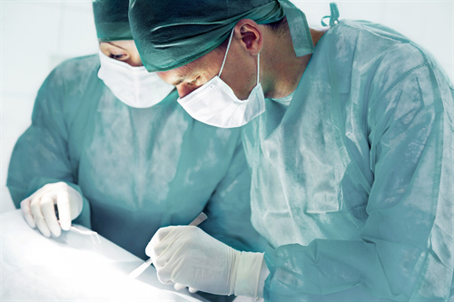 Medical examiner reviewing an assessment on a tablet